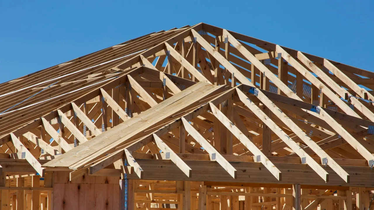 A house under construction, framed in wood