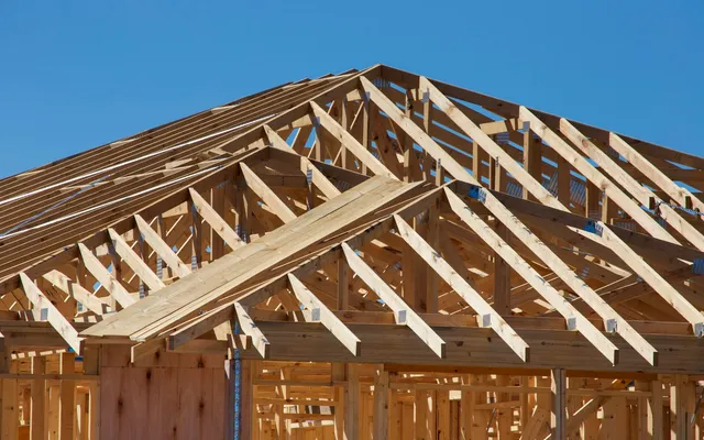 A house under construction, framed in wood