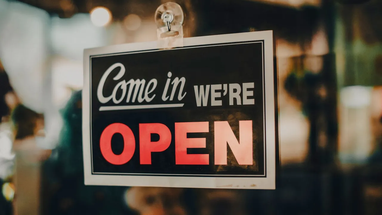 A small local business storefront with an open sign